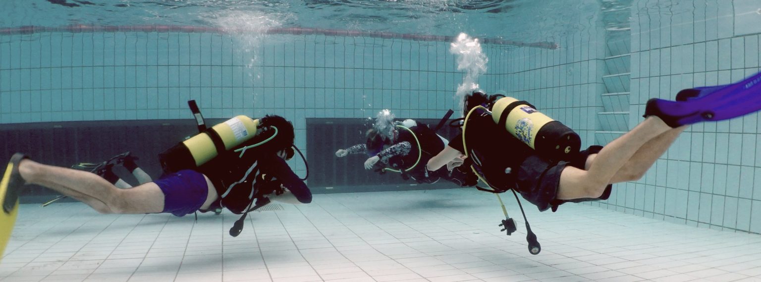 Divers practising neutral buoyancy